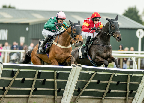 Busy Being Busy (green) completes his hat-trick at Plumpton